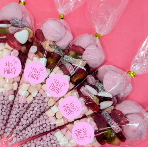 pink themes sweet cones with Hen Party sticker on the front